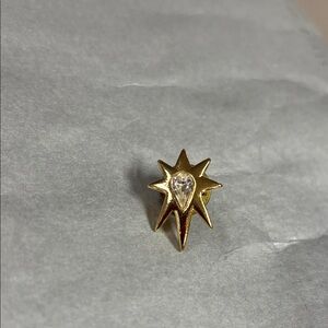 Radiant Gold Starburst Brooch with Crystal Center
